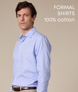 Man wearing a classic white shirt made of 100% cotton